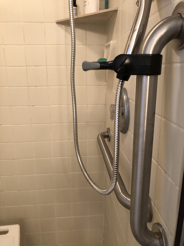 Installed five grab bars and one hand held shower spray