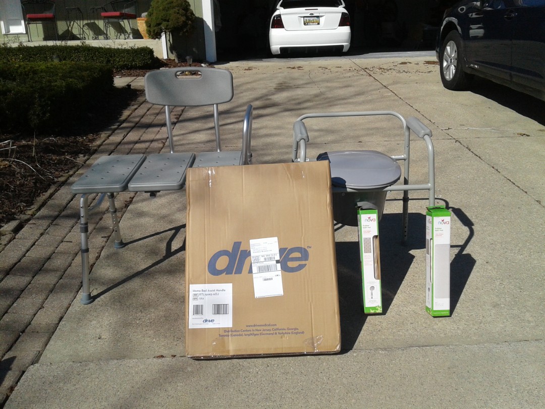 Deliver 1 tub transfer bench, 1  bedside commode, 1 bed safety rail, and 2 non slip tub mats