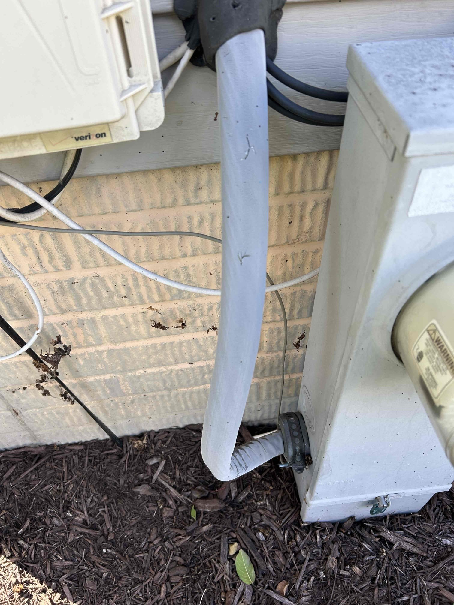 Trouble shot dimming lights to find that there is a problem with the neutral wire outside of the home. When any substantial load is put on any of the circuits, one of the legs severely drops down in voltage while the other one raises.
With just the microwave, turning on the left leg and the panel at the main lugs rose to 129 V as the right one drop down to 109 V.