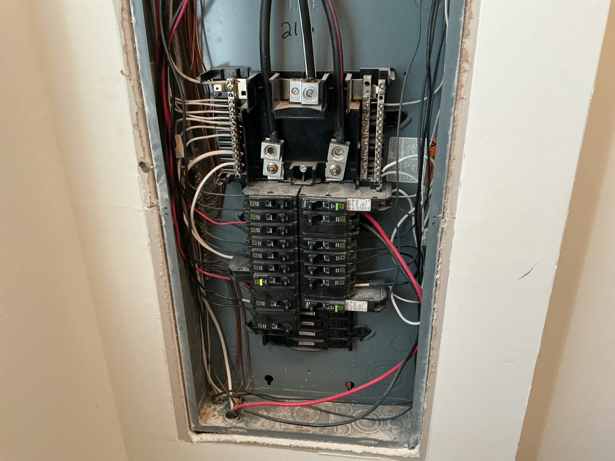 This solution includes the repairs to the 2 fixtures, correcting the open air splicing. Additionally we shall install a dimmer to operate the dining room fixture. This solution includes the installation of a whole home surge protection at panel and a common trip handle breaker for the multi feed circuits.

We have repaired the open air splicing in the existing fixtures, installed a dimmer for the dining room, installed surge protector and common trip handle breaker feeding the dishwasher and disposal.