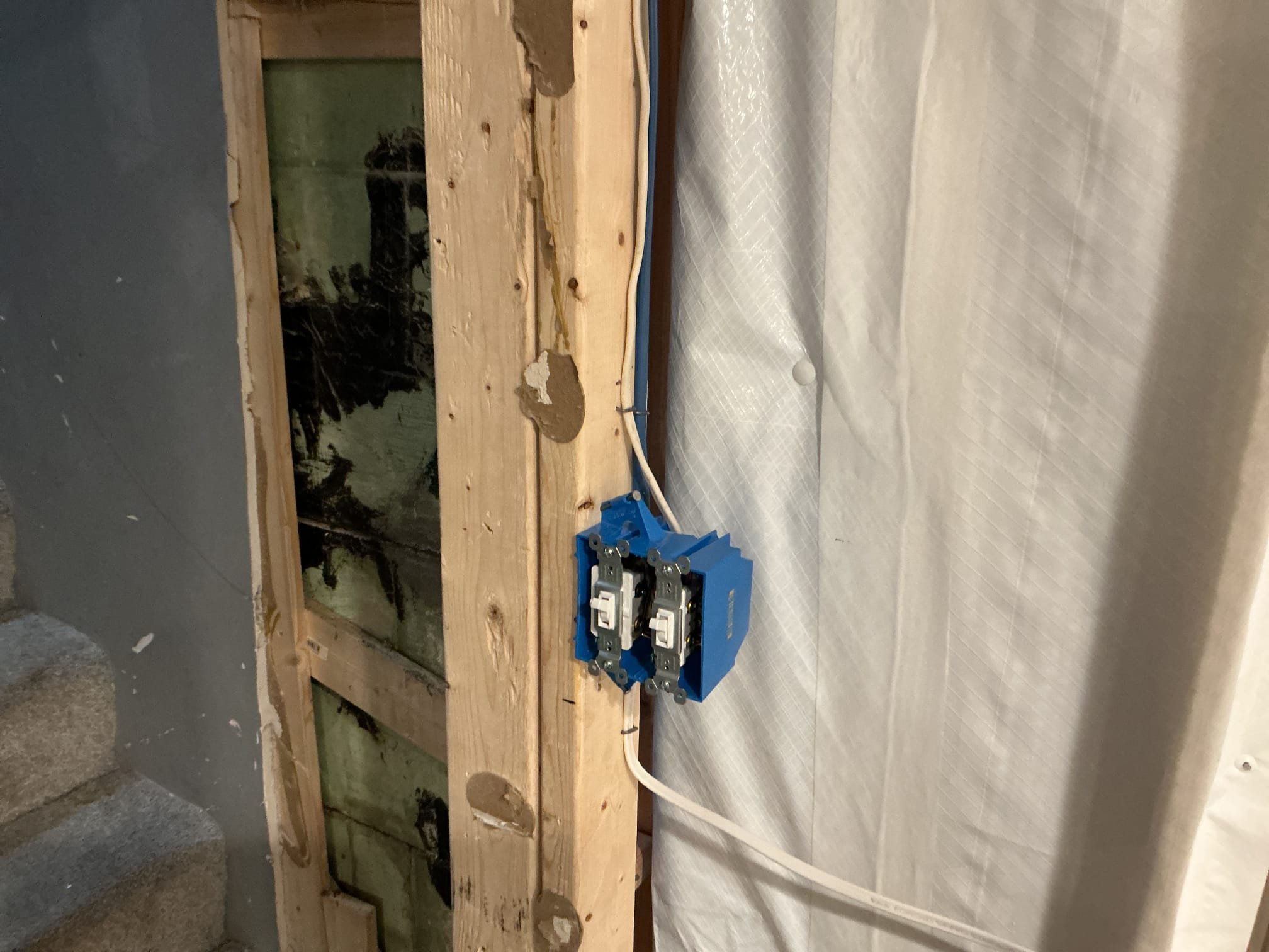 This solution includes the installation of arc fault breakers for 2 basement 120V circuits, updates to grounding and bonding and repairs for the open air splice. In addition we shall complete the rough in of the 9 receptacles and 2 switches.