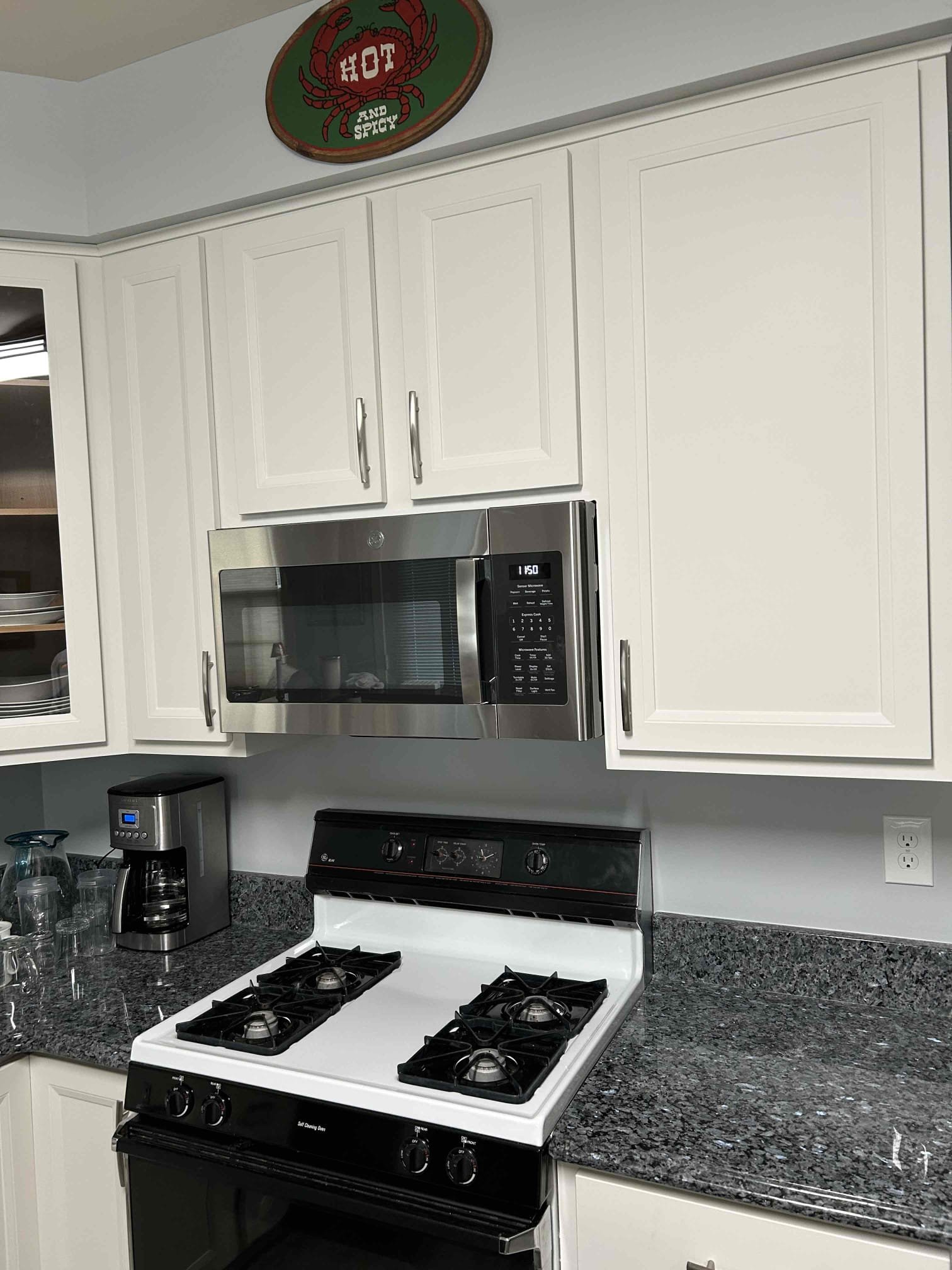 Installation of a new dedicated 120 V 20 amp line from the main panel up to the cabinet above where the microwave will be installed..
Installation of arc fall protection on the new breaker for the microwave circuit as required by code.
Installation of whole homes protection in the main panel to protect new kitchen equipment, as well as the rest of the home electrical system.