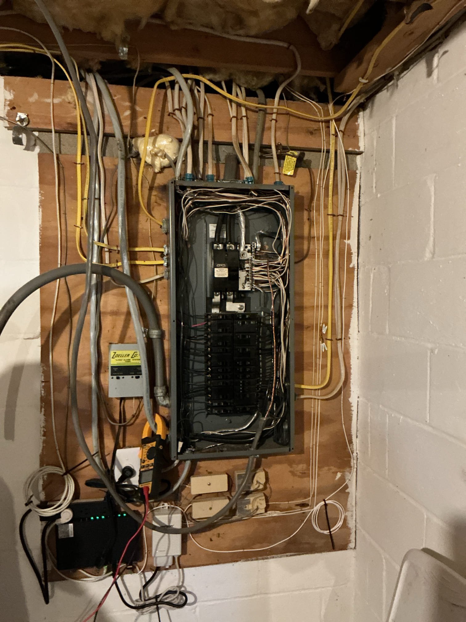 This solution includes the installation of a new switch leg to operate the exterior fixture at soffit. Includes removal of existing junction and installation of proper box to house wiring. In addition we shall alleviate the double tapped neutrals and breaker. 
We have taken deposit. Customer to call office to confirm our return.

We have installed new wiring from the existing switch to the exterior fixture. Additionally we have corrected the double tapped neutrals and breaker.