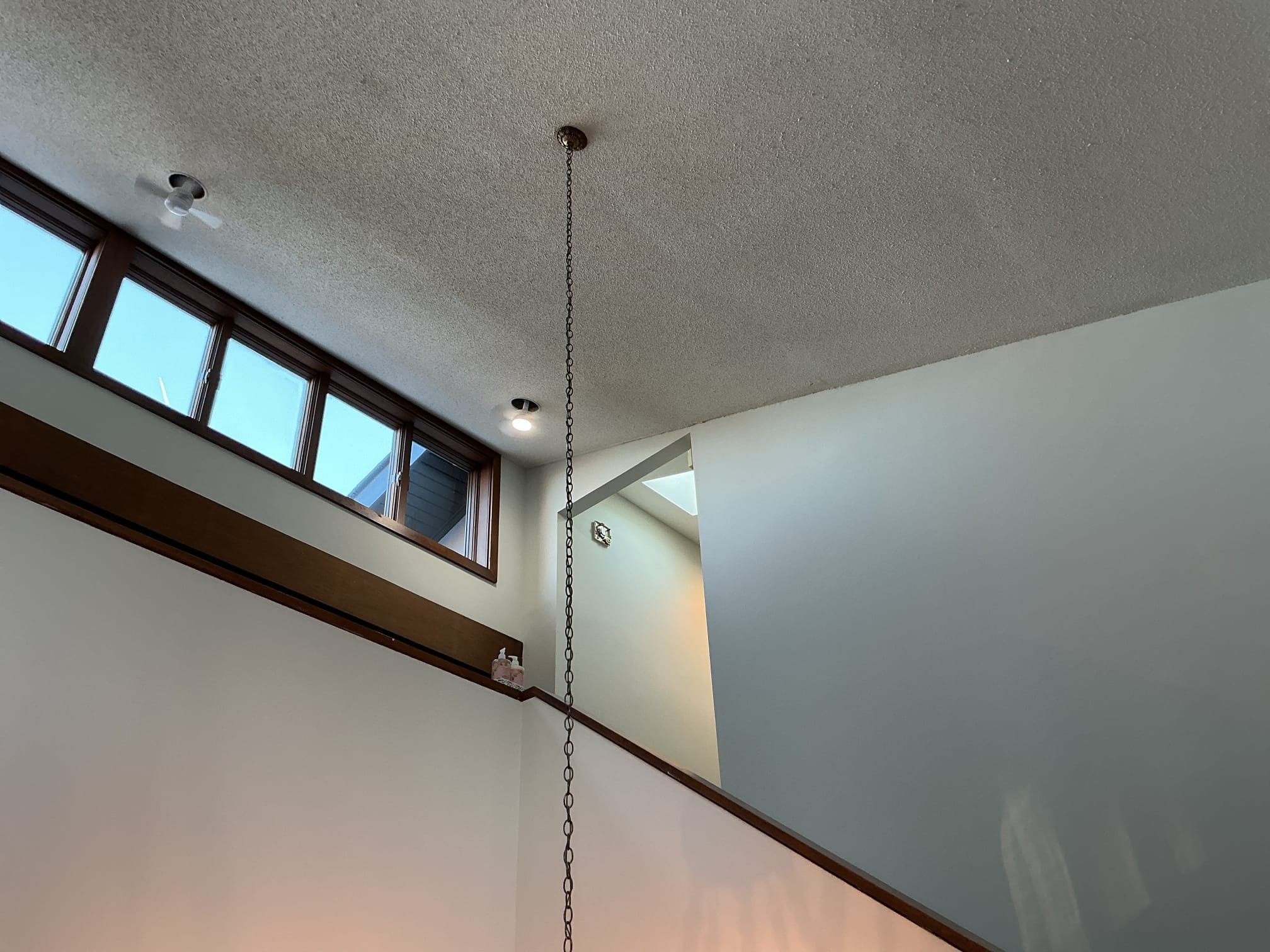 This solution includes the replacement of the existing foyer chandelier.
We have replaced the existing chandelier with a new customer supplied fixture in the foyer.