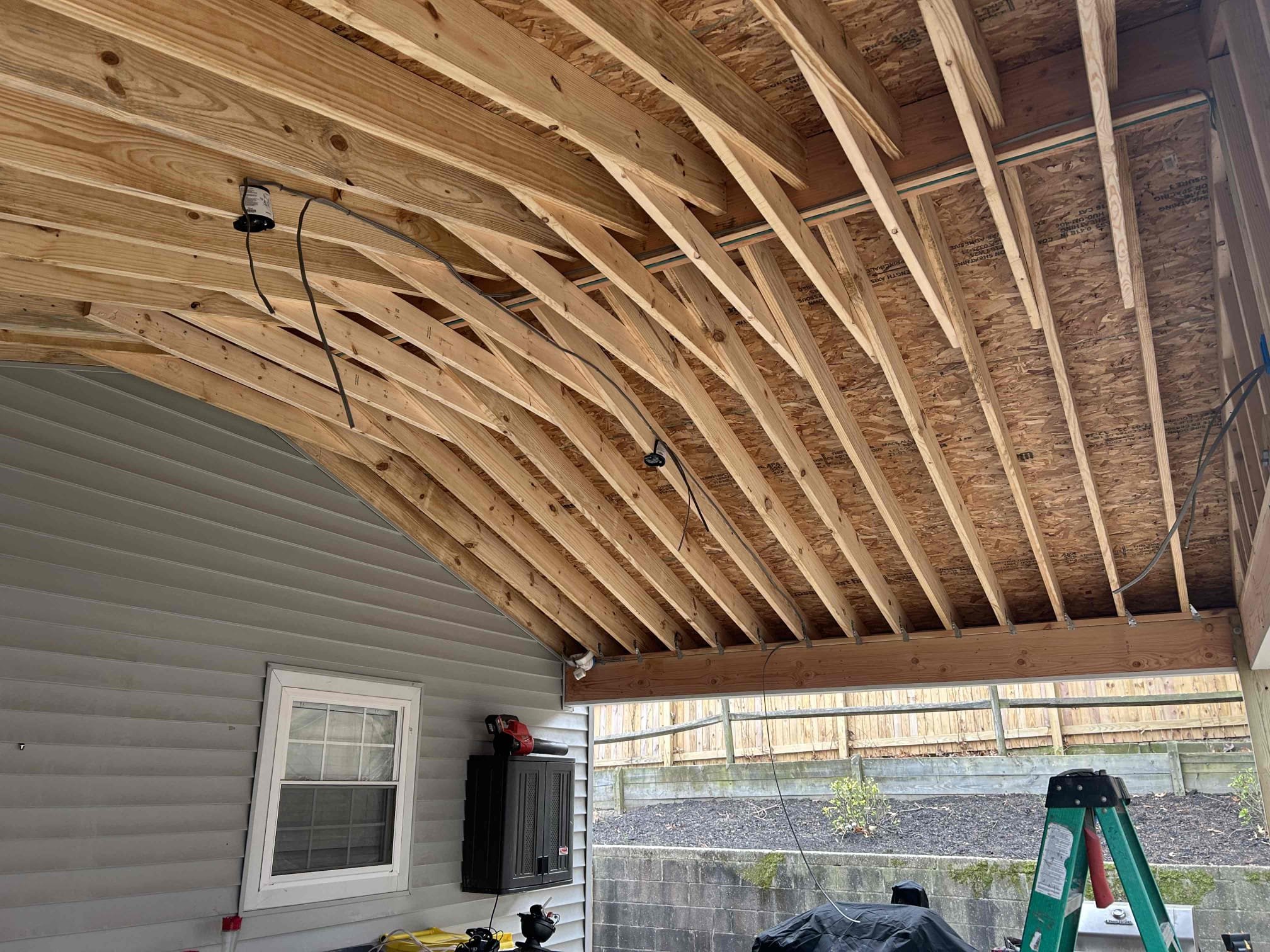 Install 2 customer supplied fans on back deck
The reason for today’s visit was to look at installing the wire back on their new deck. Customer previously had a deck with existing wiring however, when they replaced the roof, they never installed it back. The existing UF wire was in PVC up the side of the house in the back right corner where the deck starts. We ended up installing two new ceiling fan locations as well as two new receptacles. We converted the PVC over to flex and installed it into the ceiling of the deck and installed a junction box over by the security light. We ran in all wire in 12/2  UF cable.