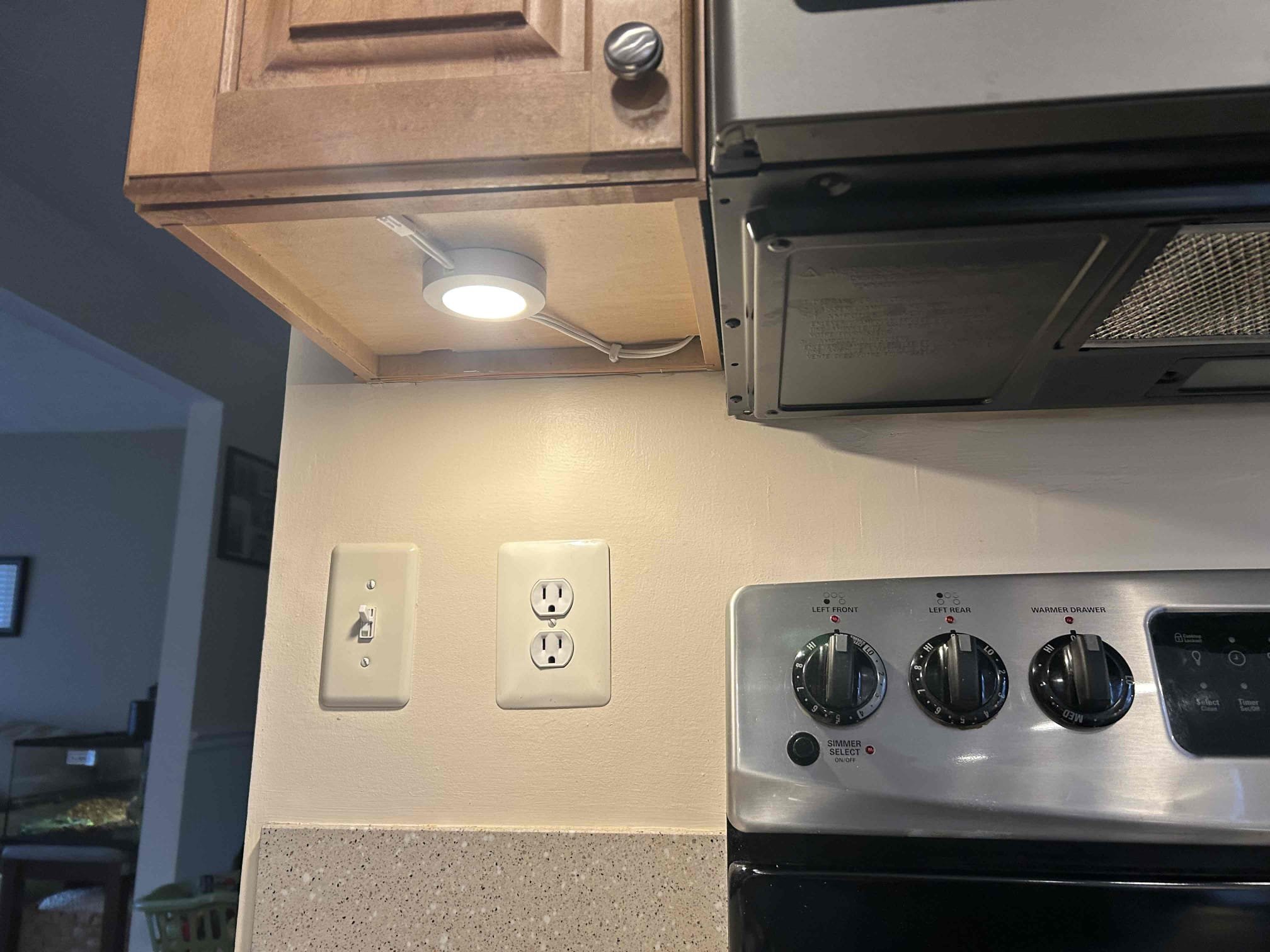 Replace 2 customer supplied cabinet lights with wiring up to junction boxes