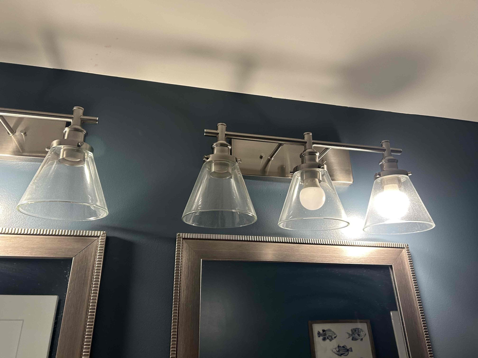 Checked some flickering bulbs in the Home. The lights in question were located in the second floor hallway, bathroom vanity lights, as well as the first floor sunroom area off of the kitchen room.
I remove the bulbs in question and put them in other locations in which they were still flickering. I tested other bulbs in the spots where the lights were flickering, and these bulbs were not. This was a clear indication that the bulbs themselves were going bad and needed to be replaced. The bulbs in the sunroom dinette area where LED Edison style bulbs and the ones in the second floor bathroom vanity light where standard LED A19 bulbs.