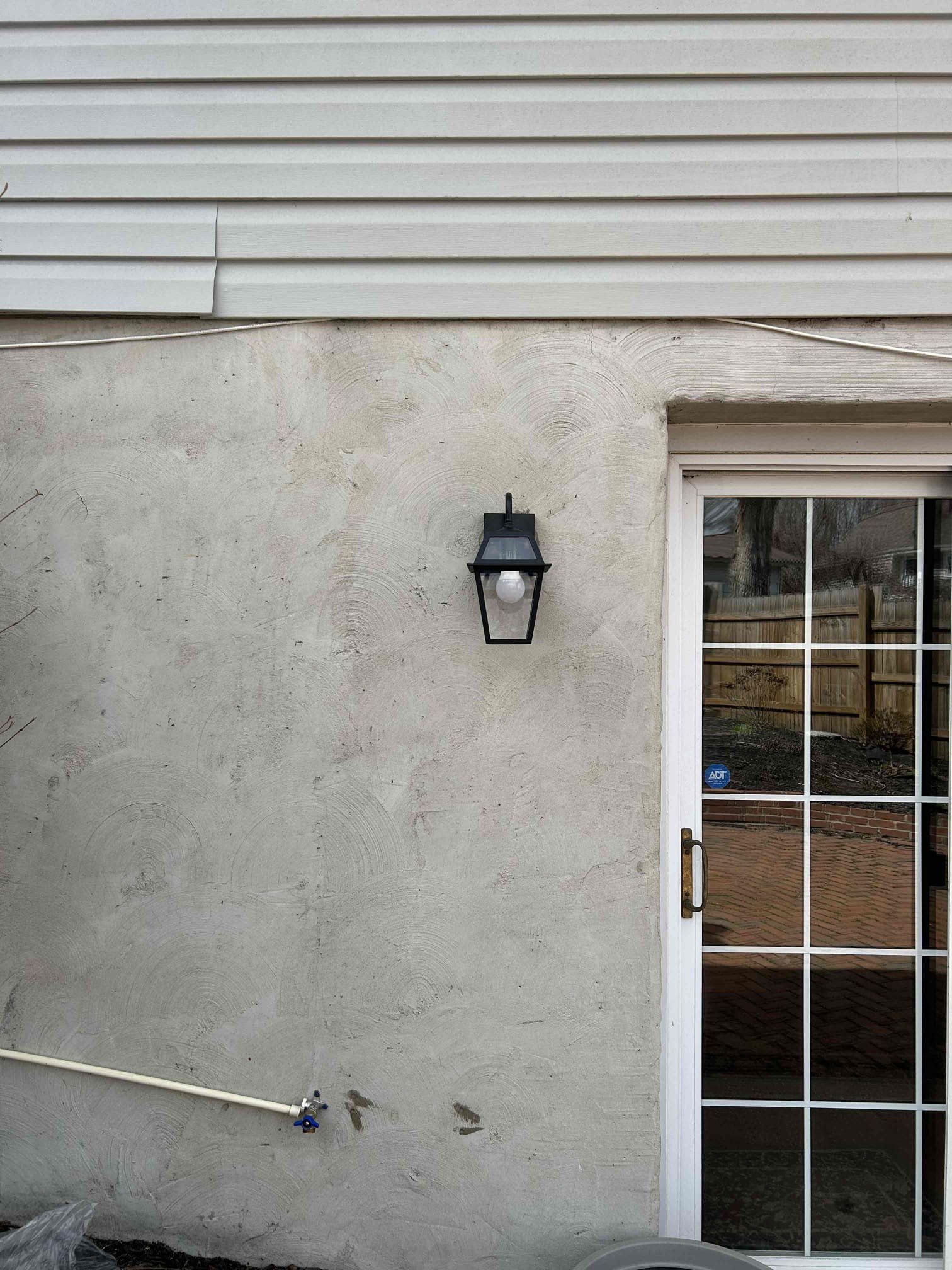 Replace 2 exterior sconce lights on the back of the home.

Well, on site, we inspected the main panel and found that the service cable was still deteriorating. It would appear that it is beginning to drywall further down than where it was a few years ago. Highly recommend having this addressed as water is getting inside of the cable and will eventually start running down into the panel as well as the meter can. 
We provide a pricing to upgrade the main panel while replacing the service cable to meet new current safety and code requirements.