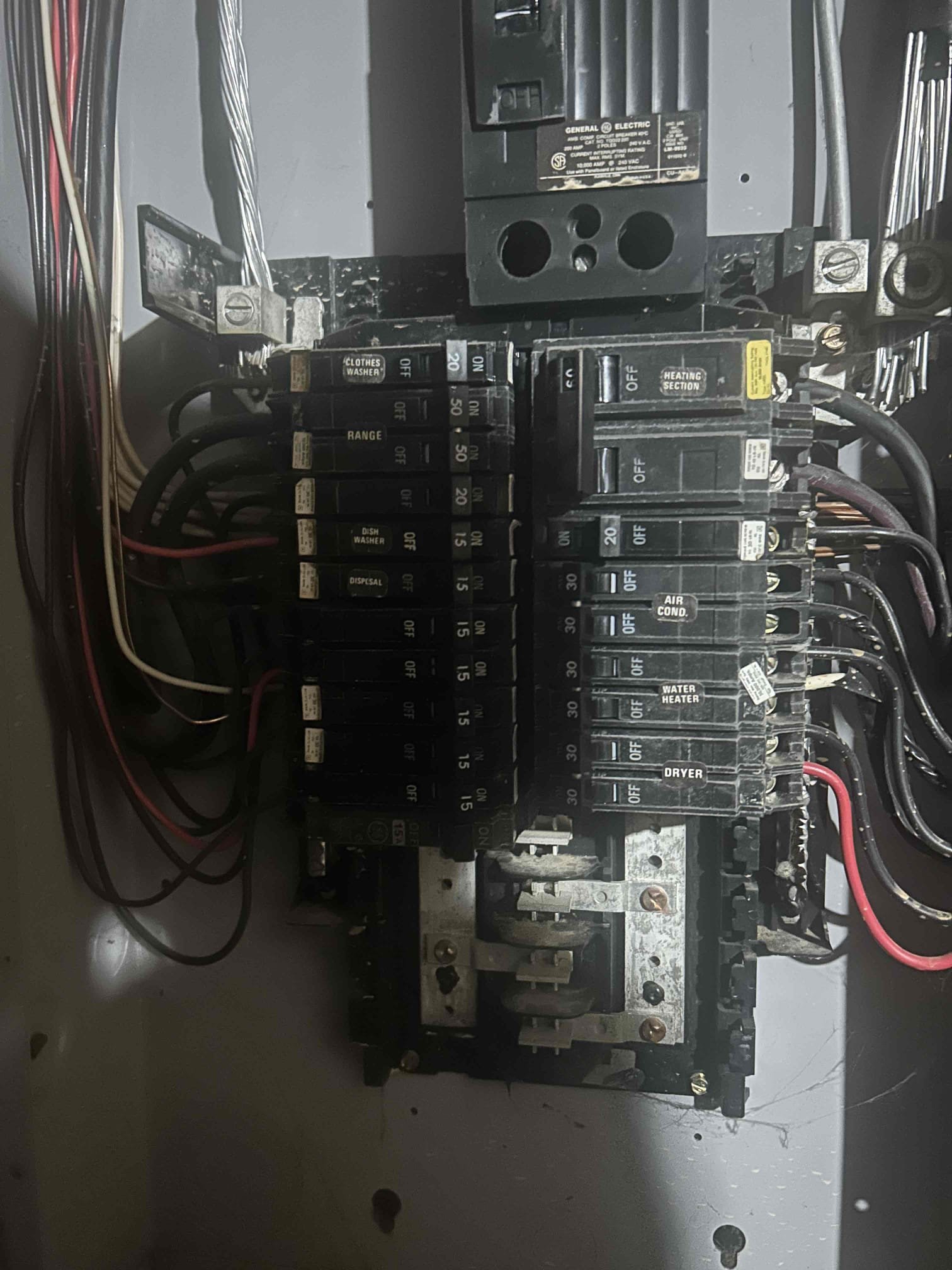 The reason for today’s visit was to assess power loss to kitchen receptacles. Today we found that the breaker feeding half of the kitchen had went bad. We opened the panel. We noticed that there were signs of water damage that had happened in the panel. We provided an option to replace the breaker as well as to replace the entire panel.
We’re checking the receptacles. We noticed that they were all still the original 1987, which were all backstabbed. Highly recommend replacing the devices to avoid future power loss issues.