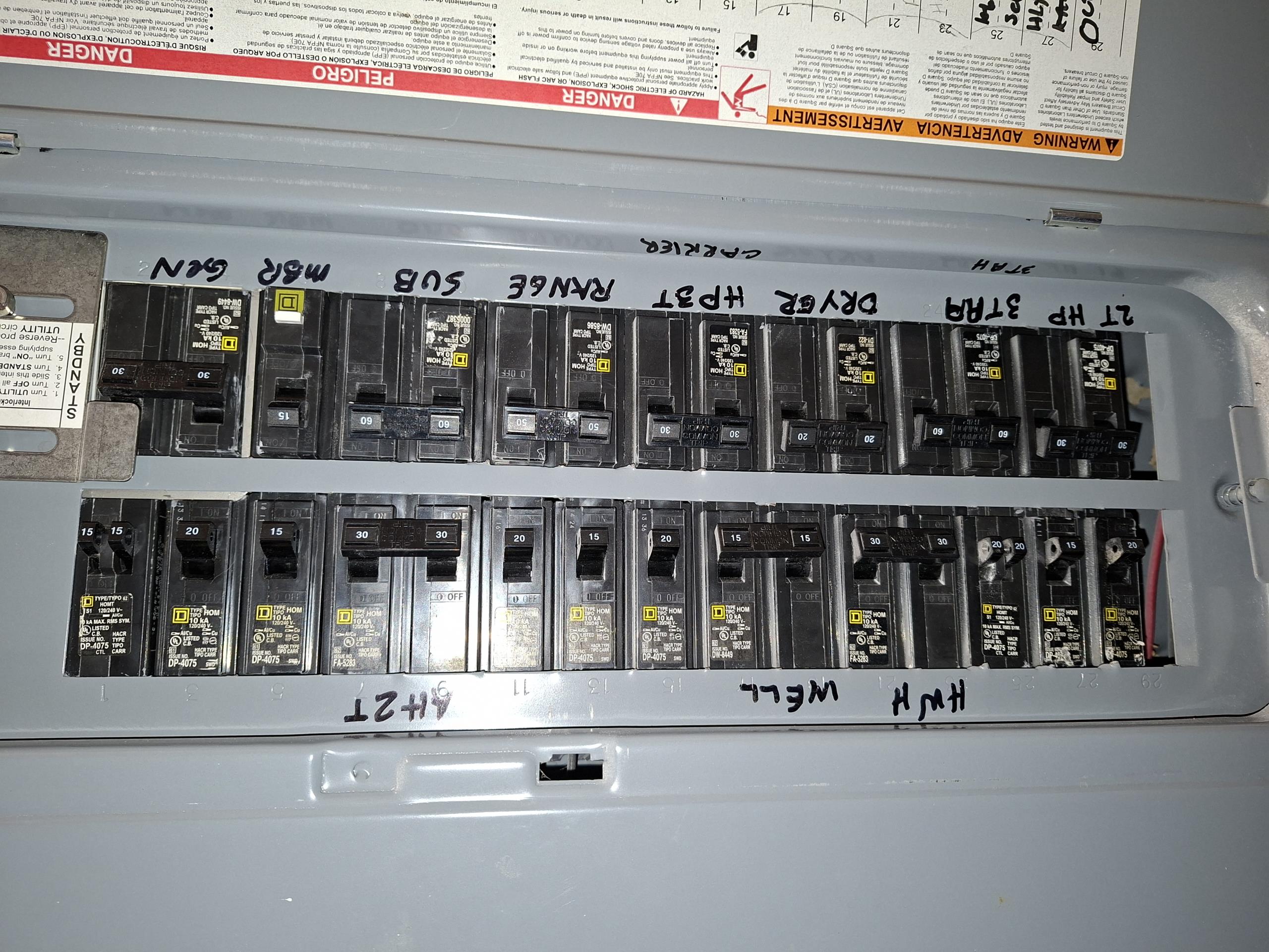 Run a dedicated 30 amp circuit from panel in hallway, through the attic, to the outside of the home, into a customer supplied car charger. Remove current generator breaker to allow the install of car charger circuit.. Replace dryer breaker to the correct size. Fix open air splice in attic.

Called out today to look at running a car charger circuit and a multitude of other electrical issues. Customer has two ceiling fans in the front living room and side room with no switches controlling them. I told the customer that these fans have constant power, having no way to turn the power off. There was also a front GFCI with no power. I discovered that this GFCI was tried into the front living room switch controlled receptacle, thus necessitating the switch being turned on for the front GFCI to work. 

I also gave a solution to run a dedicated car charger circuit from the electrical panel in the hallway, through the attic to outside, and then install a customer supplied car charger. In my solu
