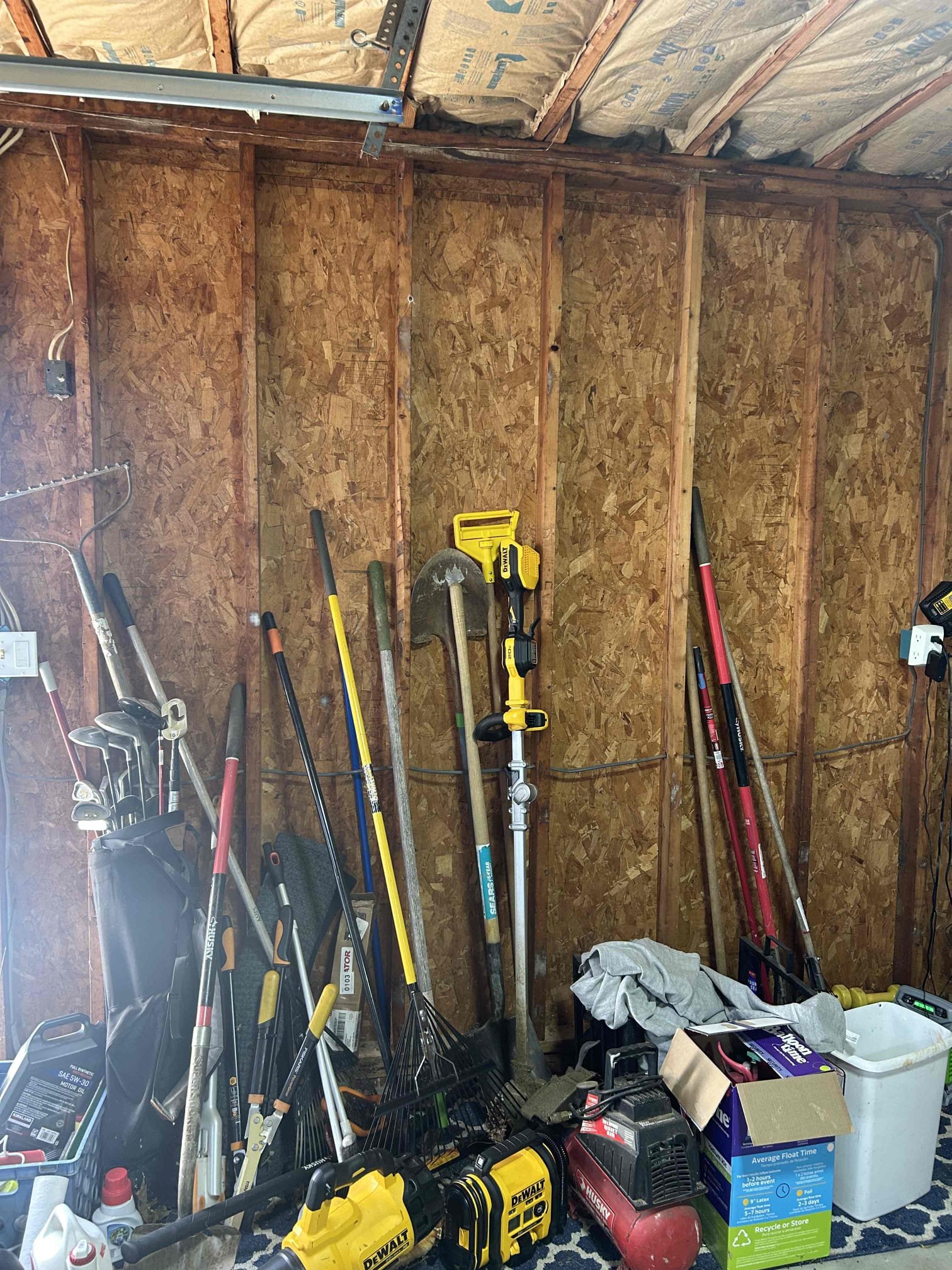 The reason for today’s visit was to look at installing a new dedicated 100 amp circuit from the main panel in the basement. Front left corner out to the garage in the back left corner of the Home. The garage itself is detached from the house so trenching will be required from the back right corner of the house out to the garage. Inside the garage we went so I knew 100 amp Q panel with grounding as well as a new dedicated 50 amp circuit out of the subpanel for a heat pump for the pool in the back of the garage. We will also need to separate the existing circuits in the garage from the house and tie them into the new subpanel
The basement in the house is mostly fully finished however, the back portion to where we will stub out underneath the deck does have an unfinished ceiling. We’ll have to run roughly 25 foot of SE cable out the back of the home and under the deck over to a junction box where we will change over to PVC.
The panel that we will be tapping out up in the house is a brand 