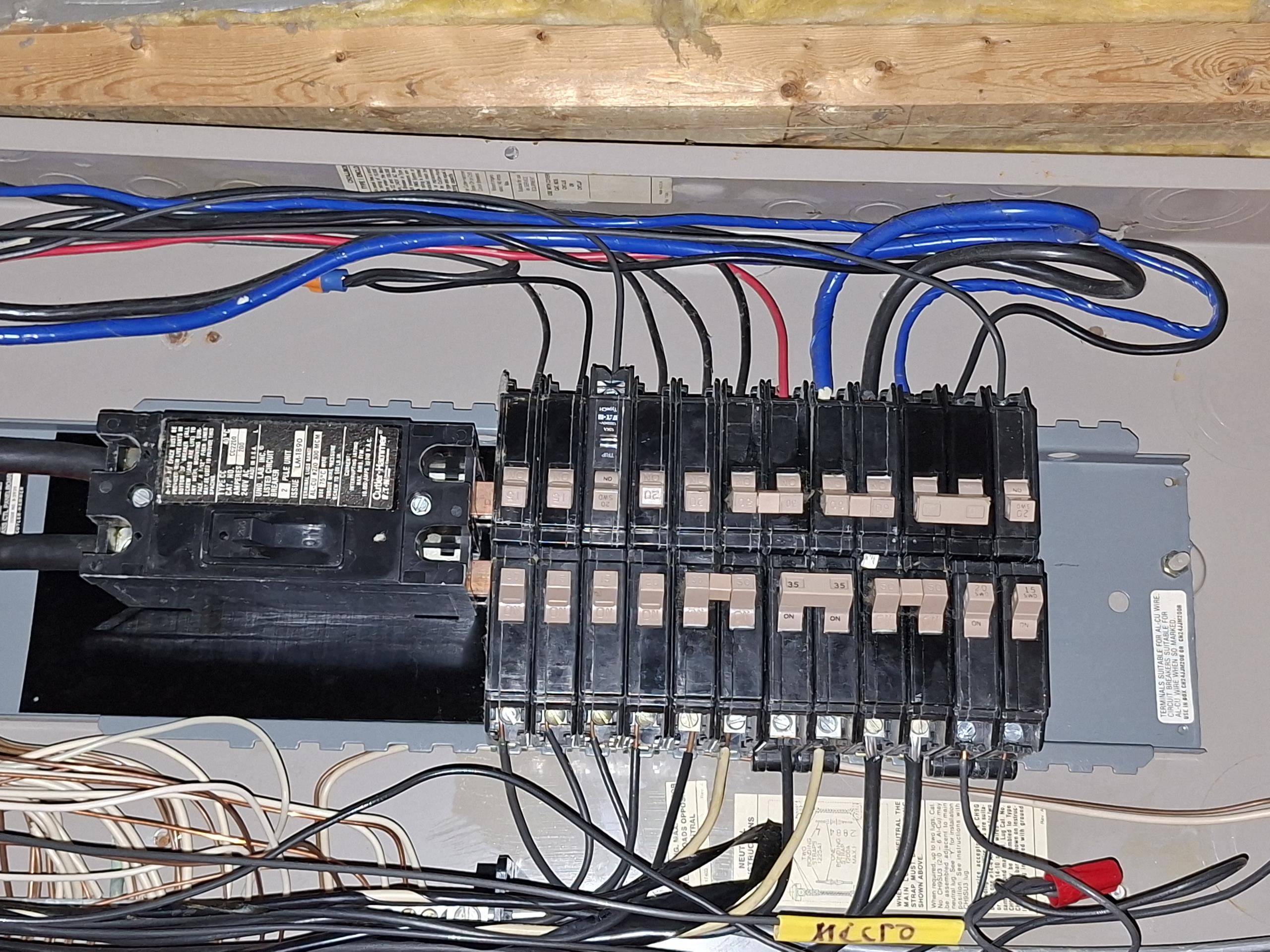 Install a dedicated 20 amp circuit from panel to directly outside by meter can. Install a surfaced mounted box, with a GFCI and the proper weather proof cover. Two single pole circuits will have to be combined to make space inside of the main electrical panel for the new circuit.