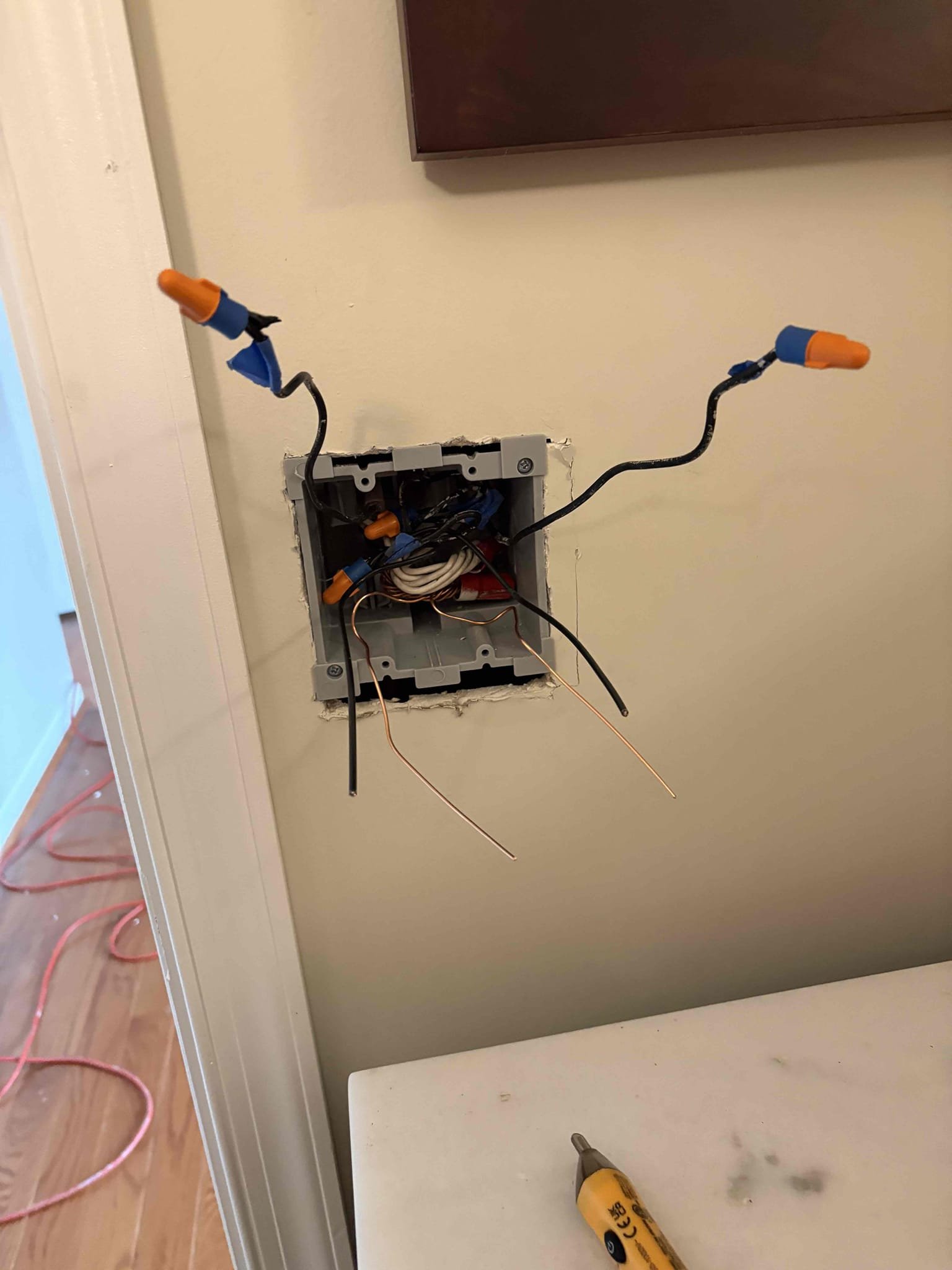 Today’s visit was for replacing a range surface mount to a flush mount outlet. He also showed us a 2 gang switch box with 5 wires in it, so we installed a 2 gang box with 2 single pole decora switches. During our inspection we found 3 multi wire shared neutral circuits, and a lack of GFCI protection on the washer and the sump pump. We installed 2 double pole breakers, and will be returning this Thursday to install the last one that we didn’t have on hand, and we didn’t have the right drill bit, and will install the range outlet when we return. We also wrote up a separate solution to replace all of the smoke detectors in the home. 

Returned today to complete rest of work. Installed flush mount range outlet and installed last two pole breaker in panel. Tested voltage to the plug and got all the correct nominal voltages. 