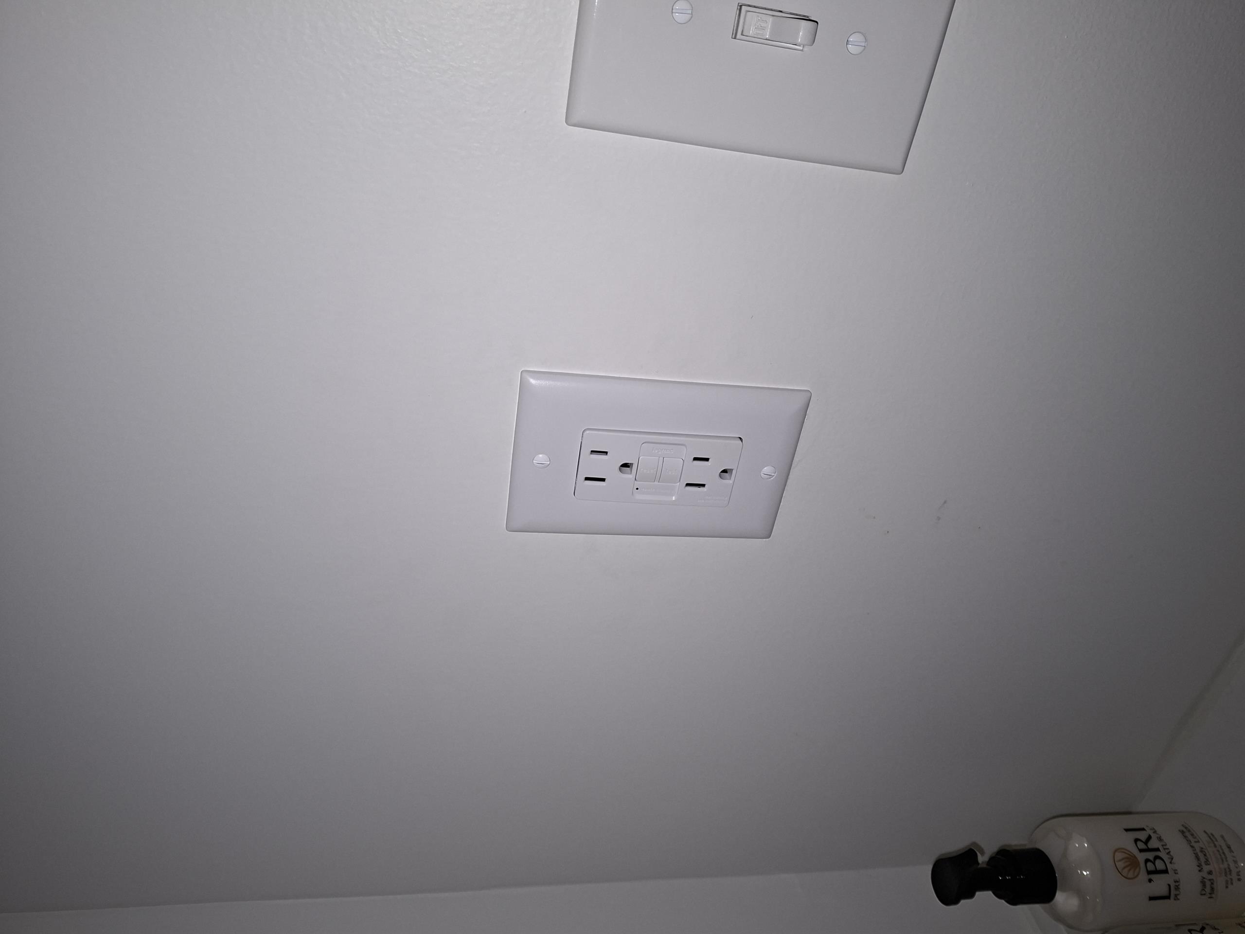 Replace four GFCIs, 2 in the kitchen, and one in the upstairs and downstairs bathroom. These will be wired to properly protect the additional devices on the circuits that need to have GFCI protection. Install a Homeline 15 amp breaker in panel to offer the proper overcurrent protection to the bathroom circuit.

Called out today to inspect electrical wiring of an upstairs bathroom that had been remodeled. I found that the outlet and bathfan/light were not GFCI protected. I discovered that the contractor had miswired multiple GFCI plugs throughout the home, including in the adjacent bathroom and downstairs in the kitchen. I also saw a lack of GFCI protection in the downstairs bathroom. During my investigation, I found 14 gauge and 12 gauge wiring splices together in the bathroom, requiring the breaker to be sized for the 14 gauge wiring, which is smallest sized wire on the circuit.

I added the correct GFCI protection to both upstairs bathrooms, protecting the circuits as required by cod