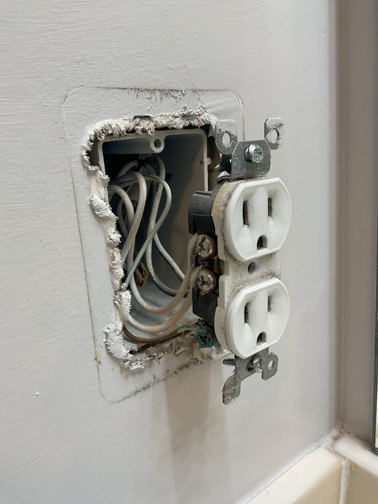 Today’s visit was to take a look at some receptacles that the homeowner described as “popping” in the dining area and the bathroom. When I arrived, I started by opening up the affected receptacles in the dining area, which I noticed were a part of the condo’s kitchen circuit. The receptacles were originally installed using improper terminations (Wires oriented the opposite way under the screw terminals/insulation left under screw terminals) and were causing arcing due to those loose connections. This most certainly can cause the popping sound heard, and the bathroom receptacle was also installed in a similarly hazardous fashion. We also checked the microwave receptacle which was installed properly, Ms. Susan wanted to ensure it could support a new microwave and it is in great shape to do so. I went throughout the home and opened up a few other devices to check if there were other devices installed in the same manner and found backstabbed/loose connections throughout the home. I also to