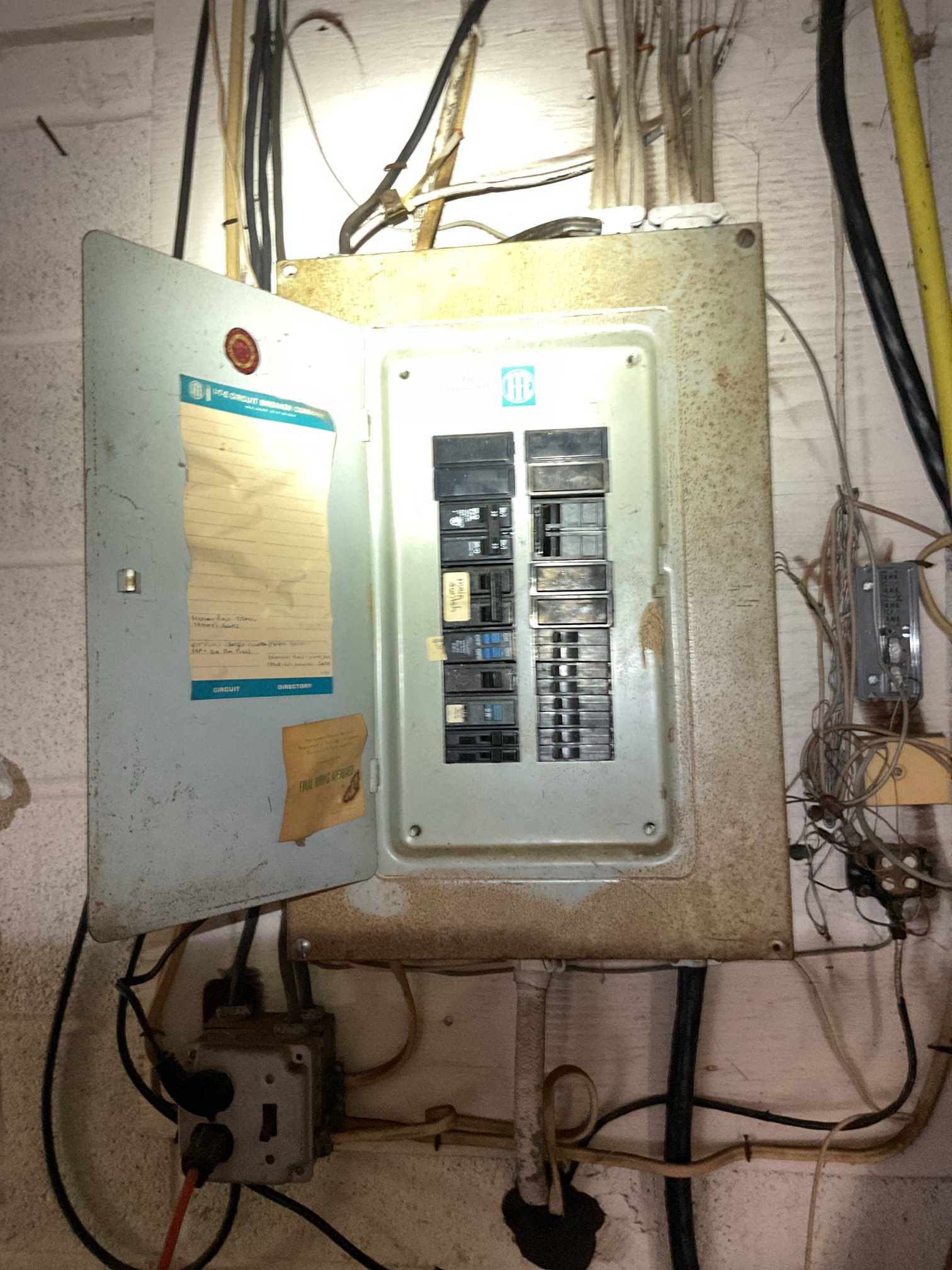 Today’s visit was to take a look at a broken dimmer switch. When I arrived, I took a look at the switch, which was not turning on the living room recessed lights. I also took a look at the main electrical panel, which had some corrosion present as well as paint in the interior. The service cable entering the home is very damaged on the exterior, to the point that the sheathing is almost entirely gone. I brought this to the homeowner’s attention, and she told me that she was already aware. I also saw that most of the receptacles/switches in the home were more original and some were painted over/damaged. The homeowner declined any solutions for a whole-home redevice and/or panel replacement and exclusively wanted me to replace the dimmer switch with a rotary-style dimmer. I picked up a replacement rotary dimmer and replaced the broken one, all dimmers for the living room are now working well.

- removal and replacement of broken dimmer switch controlling living room recessed lights