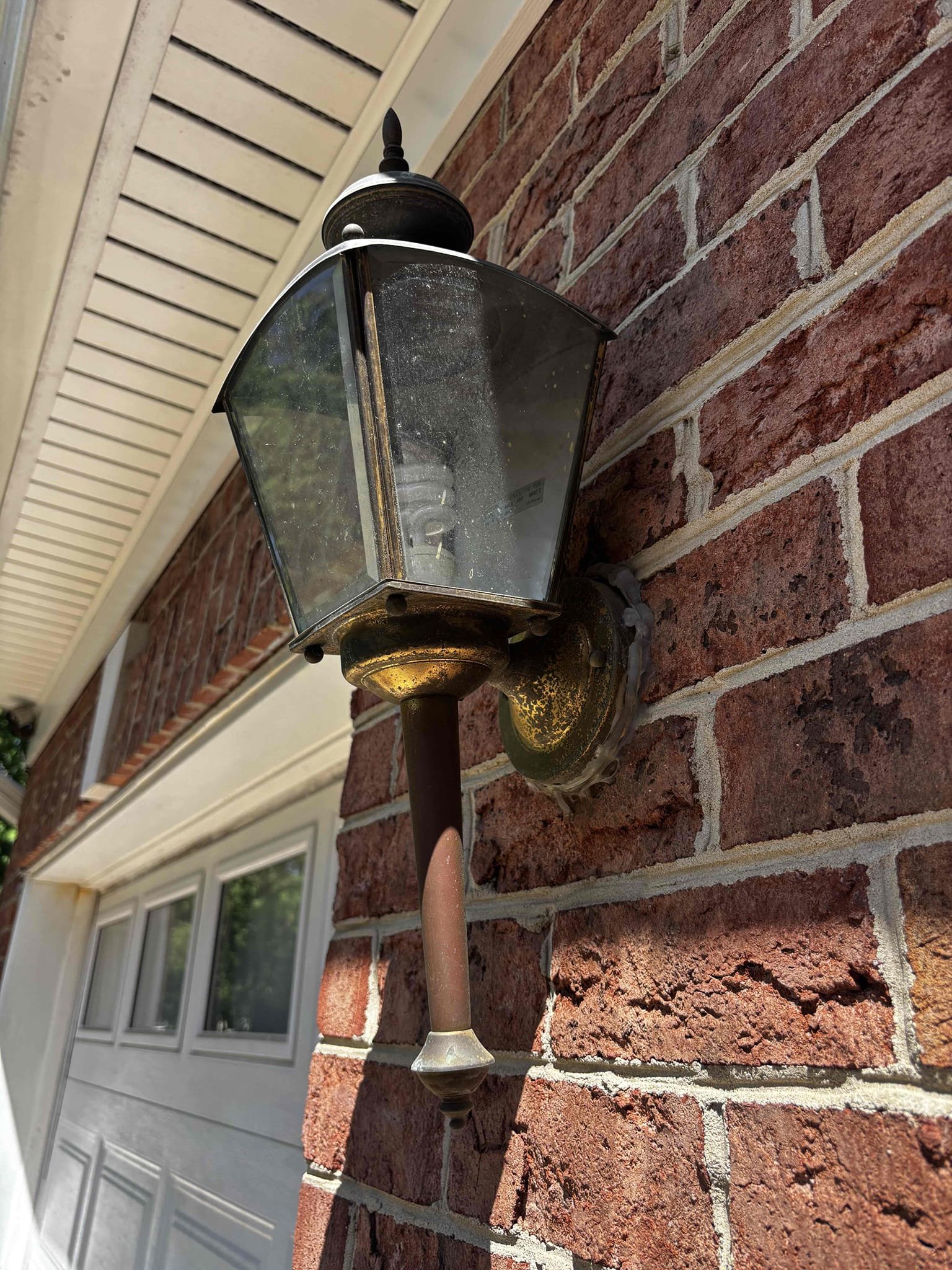 Install outlet for garbage disposal and replace 3 exterior light fixtures with customer supplied new ones
