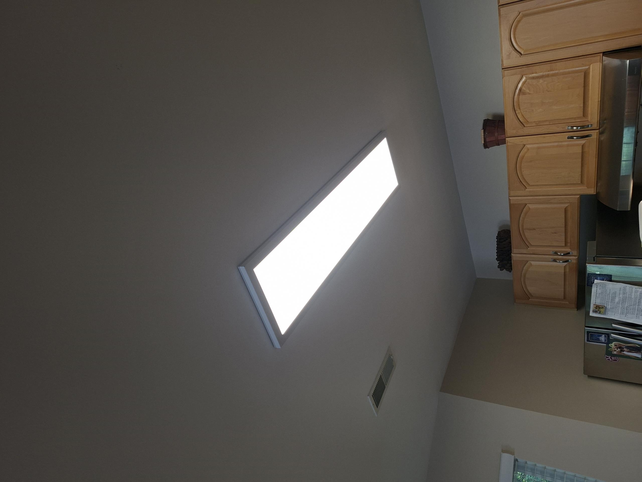 Install Company supplied flat panel light in kitchen. Replace switch controlling light in 2 gang switch bank with a dimmer.

Called out today to look at replacing a fixture in the kitchen. Fixture was an old fluorescent fixture, that would turn off after it was activated within a few seconds. Due to the age of the fixture, I recommended replacing the fixture with a new LED flat panel light. Customer agreed to replace the fixture and install a dimmer as well. 