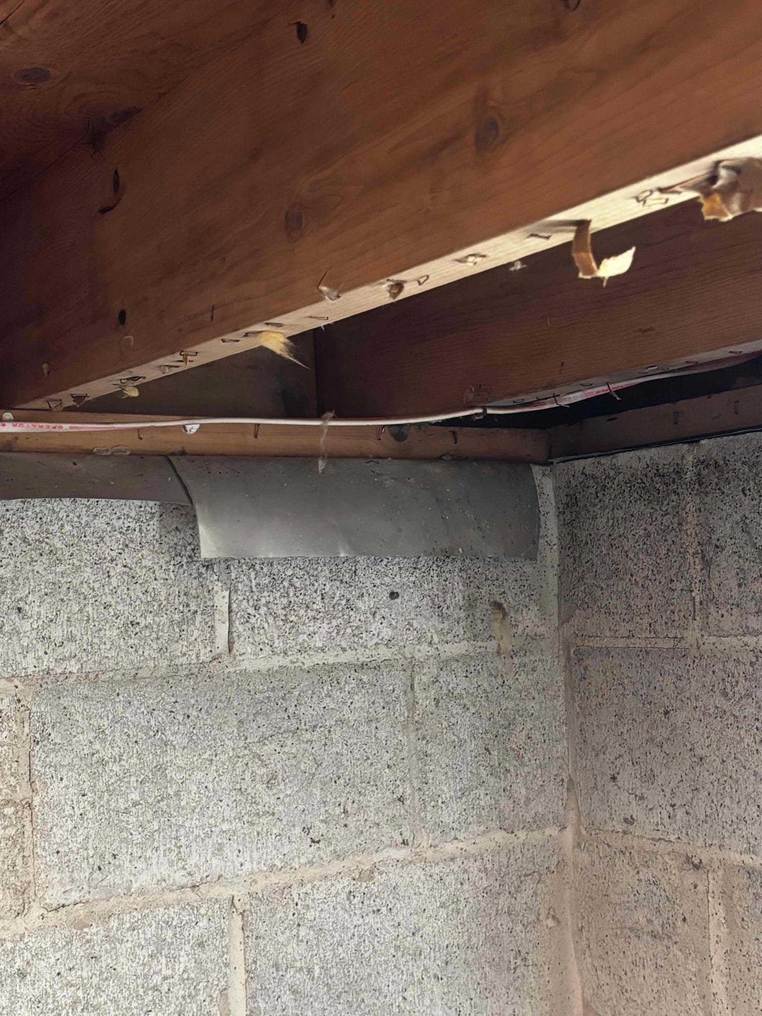 This estimate will include re-routing multiple cables supplying inside the crawl space. The reason to do this is so the cable can be properly installed through the floor joist as opposed to underneath them. This will allow proper installation of insulation to help prevent rodents from entering the home. This work will include disconnecting opened air splices and routing the cable through newly drilled holes in joist. Additionally we will install two junction boxes to house opened air splices. Lastly we will run a cable from the existing light fixture down to a new location by the door to install a light switch.