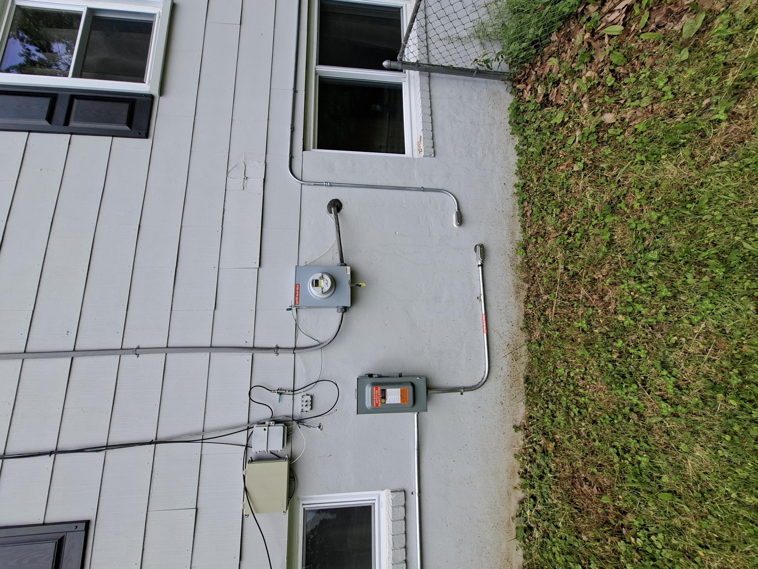 Install 2-pole breakers inside main electrical panel to correct multiwire branch circuits. Replace old Bryant 2-pole 40 amp breaker with BR 2-pole 40 amp breaker. Install surge protection in the main electrical panel to protect sensitive electronics throughout home from surges. Install two customer supplied light fixtures. Add bonding wire between hot and cold pipes by the water heater. Add a GFCI and replace weatherproof box on left side porch. Add ground rods to main electrical panel to ensure the panel is safe and in compliance with national and county safety standards.

Called out today to look at replacing 2 customer supplied fixtures. Performing my safety assessment, I started at the panel. Opening up the panel, I saw a newer BR panel that appeared to be installed in the past few years. Inspecting it, I saw multiple multiwire branch circuits not on the correct 2-pole breakers, a lack of surge protection, as well as missing ground rods. Ground rods are required as a secondary sour