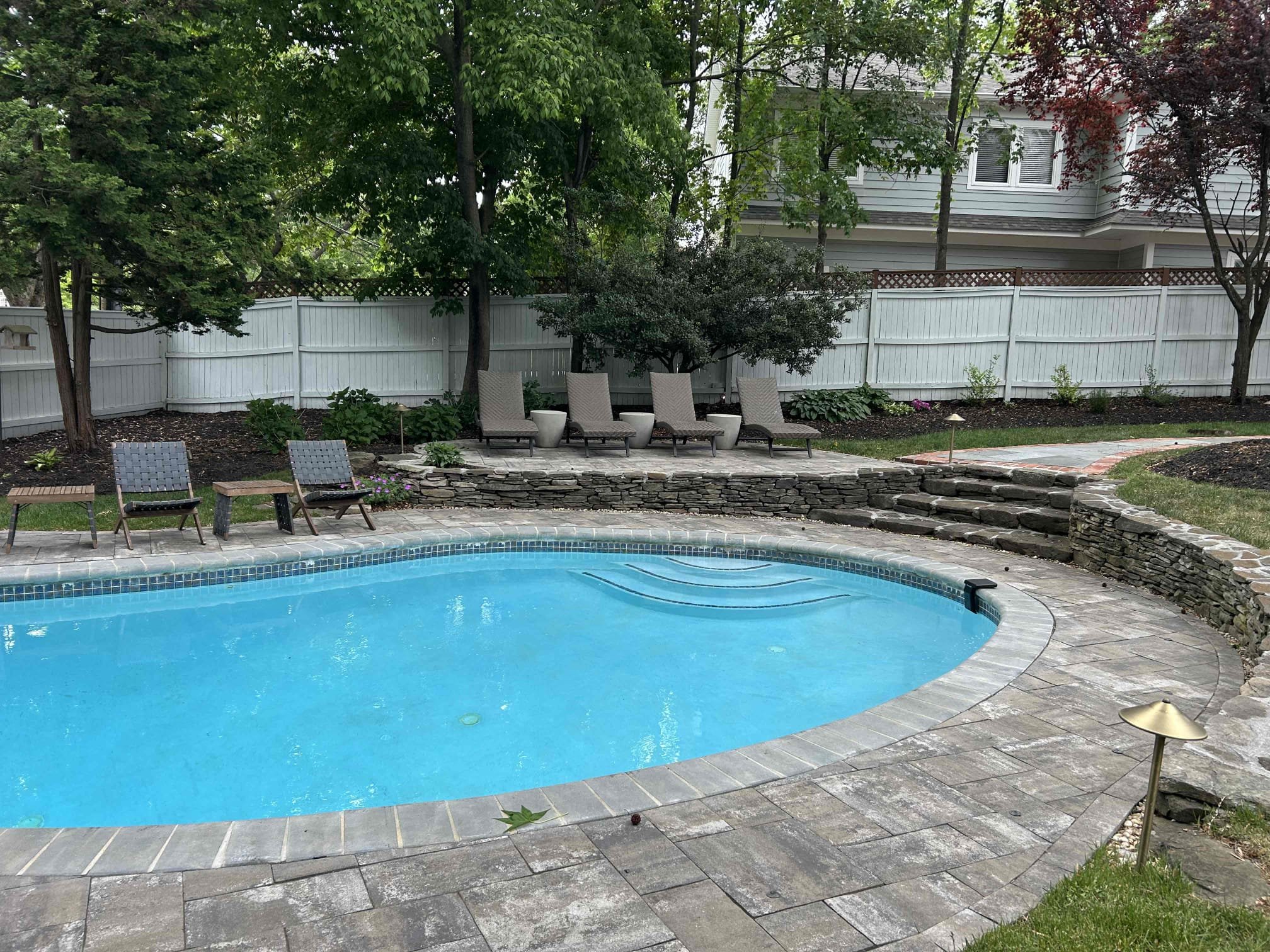 Install 6 new customer supplied volt lights around yard
We installed four new pathway lights along the new side pathway along the left side of the home as well as one new pathway in the back of the fire pit area and one new spotlight on the large tree next to the pool.