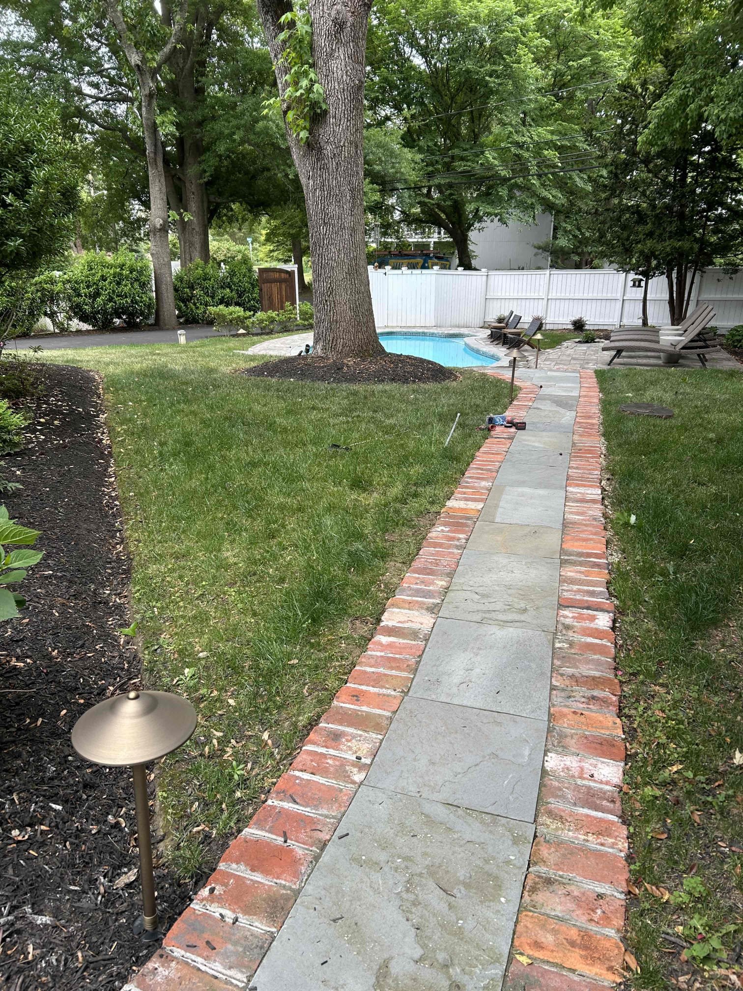 Install 6 new customer supplied volt lights around yard
We installed four new pathway lights along the new side pathway along the left side of the home as well as one new pathway in the back of the fire pit area and one new spotlight on the large tree next to the pool.