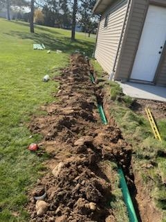 Install gravity drain system for gutters and driveway drain to lead any potential water away from house