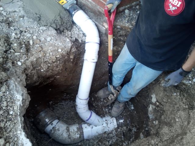Trough drain along face of garage 