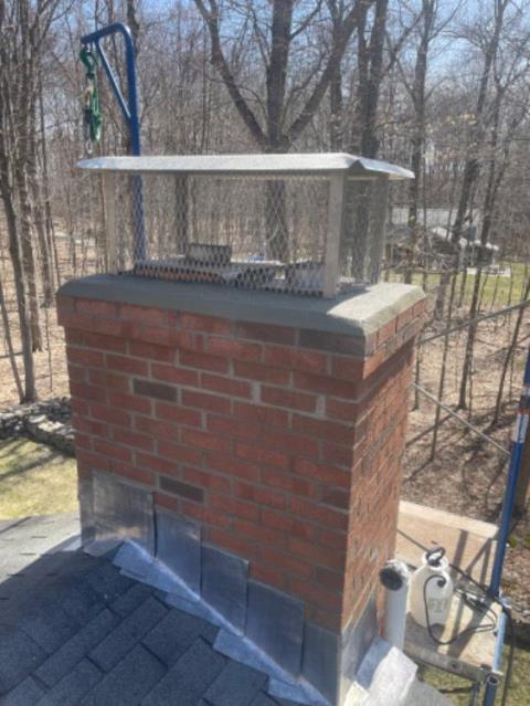 Ridgefield CT Chimney cap screen was rotted away , and improper clearances causing draft issues.   Masonry was in rough shape , rebuilt top and installed custom height stainless steel chimney cap.  