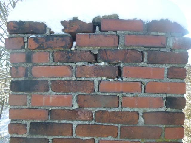 Severely compromised chimney structure - Mason crew tore down and rebuilt the chimney from the roofline up including new lead flashing where the roof and chimney meet.  