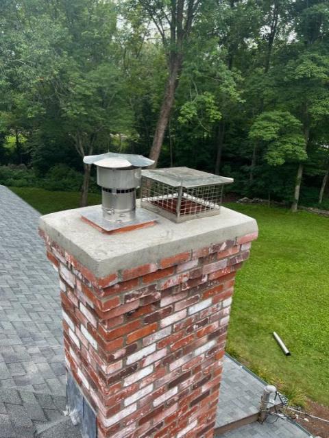 Short chimney rebuilt and a new liner to safely vent woodstove 
