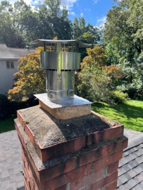 Oil heating system wasn't venting properly per oil company - the chimney was completely unlined except for flue tile at top.  Installed properly sized chimney liner system for safe chimney venting.    