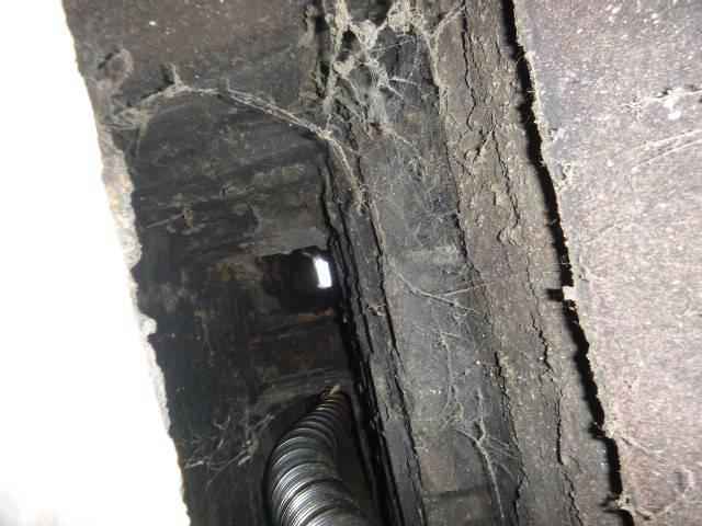 Simsbury clay flue tiles missing and furnace flue was venting into fireplace flue - unsafe  chimney venting scenario in Simsbury ct   Installed stainless steel liner system properly sized for the oil heat furnace chimney 