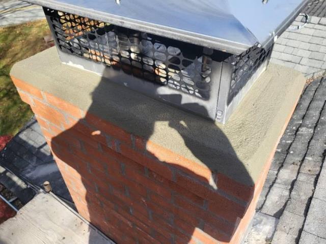 Moss damaged Tolland ct chimney rebuilt from roof up , new shingles , flashing and brick and mortar and cap
