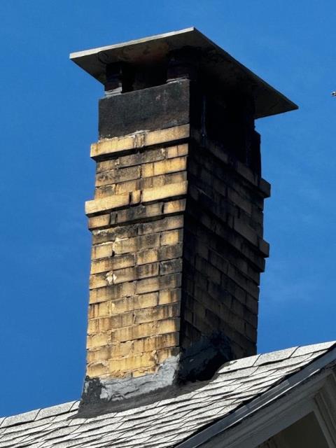 New Haven chimney inspection.  We found the chimney was unlined , built before the code for clay tile liners.  Exterior chimney had water and soot  staining and damage.  It had a spot repair of tar on the flashing which is often a sign of having a leak problem in past.  Reccomended new gas tight stainless liner and a roof up rebuild of chimney.  