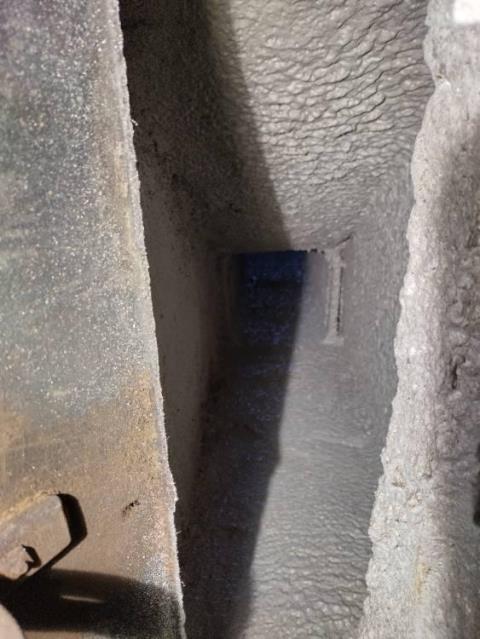 Found deterioration and cracks throughout fireplace and gap behind tile in chamber.  Wasn't damaged enough to warrant complete tile removal and liner installation.  Installed high temp heashield throughout smoke chamber and flue liner.  