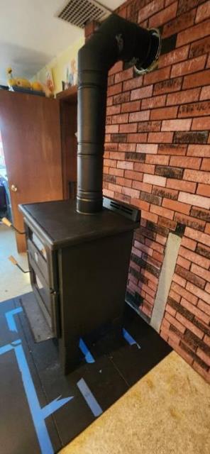 Blloomfield customer called us to install a woodstove into a preexisting dediciated stove chimney.  The thimble was in rough shape and there was actual wood as support.  We removed the wood , replaced the thimble with a proper insulated pipe and support , and installed new stove.  Let their be heat! 