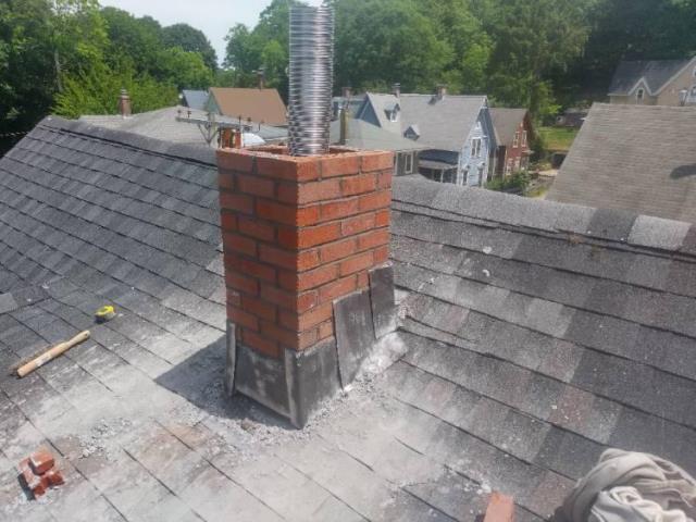 Rebuild and liner installation project on an unlined chimney.  Proper size liner installed to safely vent the heating system , as you can see how oversized the orignal chimney is.  Flue gasses can't escape if they cool to quickly in a chimney. 