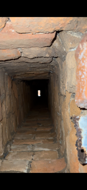 Rebuild and liner installation project on an unlined chimney.  Proper size liner installed to safely vent the heating system , as you can see how oversized the orignal chimney is.  Flue gasses can't escape if they cool to quickly in a chimney. 