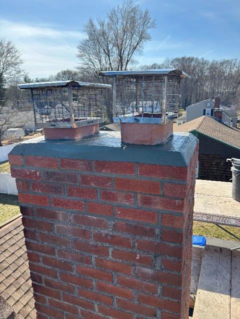 Partial rebuild top foot of chimney and new single flue caps for fireplace and furnace flue tiles in East Hartford CT 