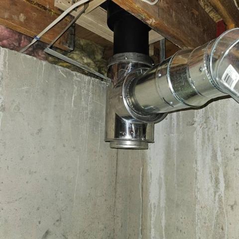 The furnace pipe here was leaking and held together with tape. Safeside Chimney installed all new connector piping