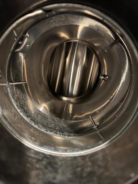 The flue tiles in this chimney were spaced out and allowing exhaust gases to escape the flue prematurely. Safeside Chimney installed a stainless steel 2-ply chimney liner.