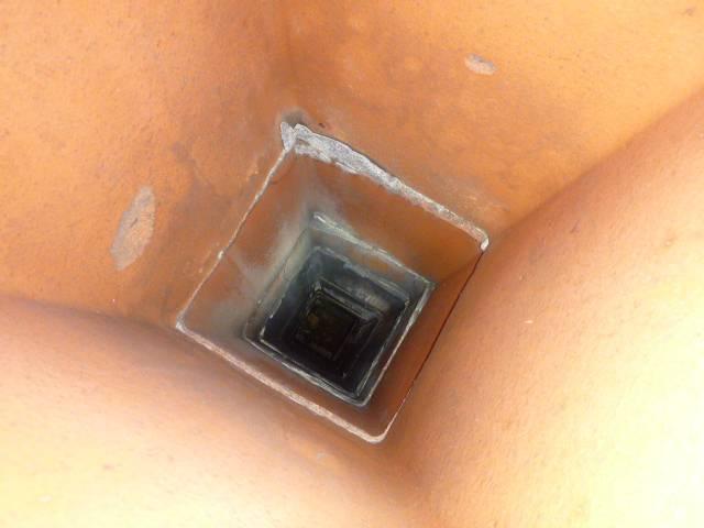 In this chimney in Manchester, CT, we found the flue tiles to be separated. The cement between was cracked and missing in some places. We installed a stainless steel 2-ply 316L chimney liner.