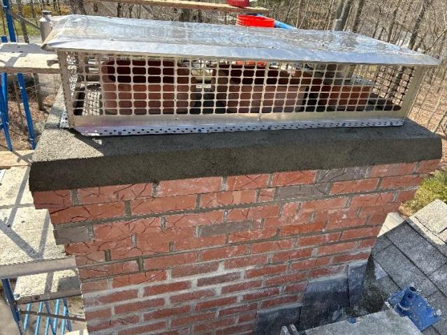 Chimney in Old Lyme CT , we found exterior of this chimney has been subject to several years of water entry, penetration and saturation activities. We rebuilt a portion of the exterior with new brick and mortar, installed new flashing, poured a new crown, and a new chimney cap. Chimney in Old Lyme CT , we found exterior of this chimney has been subject to several years of water entry, penetration and saturation activities. We rebuilt a portion of the exterior with new brick and mortar, installed new flashing, poured a new crown, and a new chimney cap.