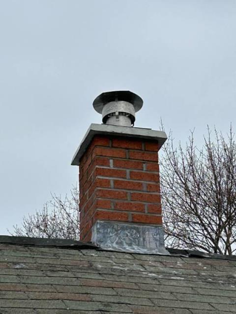 Took a look at this chimney in Enfield CT and found that the Top of the Chimney Had Sulfuric Acid and Structural Damages Developing Down to the Roofline. Performed a roof up rebuild, including flashing, cap, and crown.