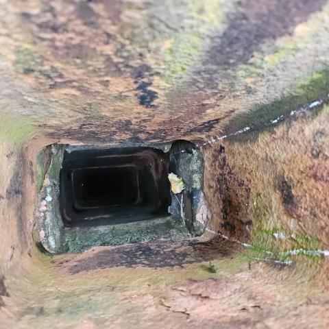 Level I Chimney Inspection performed on a Darien Ct flue system revealed severe deterioration of tiles, and areas completely devoid of tile and masonry. Installed a UL listed chimney liner kit.