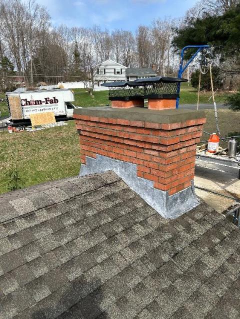 Safeside Chimney performed a roof up rebuild, with new brick , mortar and we reflashed the chimney.  We reinstalled the existing caps.