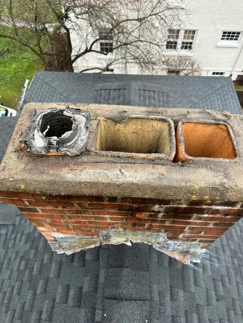 Installation of multi-flue rain cap to cover all three flues to keep them protected from rainwater, critters, as well as acting as a spark arrestor to stop any embers from coming in contact with the home.