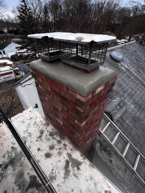Top Of Glastonbury CT Chimney Has Saturation and Structural Damages Developing Down to the Roofline. Loose Brick, Fractured and Lifted Cement Crown, Open Mortar Joints Allowing Further Water Entry, Separation Between The Brick and Cement, Failing Flashing, Damaged Fireplace and Boiler Flues. Chimney will be rebuilt, including flashing, crown, and cap.