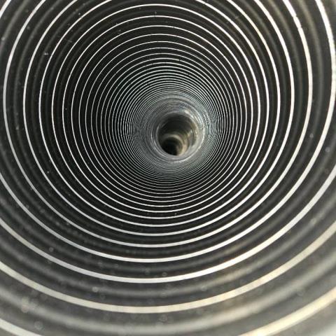 Installed a Properly Sized Stainless Steel 2 Ply Smooth Wall Lining System From The High Efficient Boiler Then Continually Ran To The Top of the Chimney To Ensure Safe and Proper Venting Of All Exhaust and Acidic Moisture Until Out Top of the Home. This Will Then Help Keep the Entire Chimney Structure Protected As Well as The Inside of the Home.